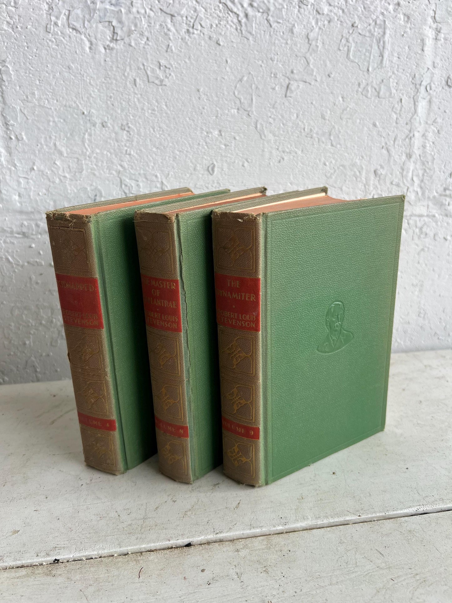 VINTAGE BOOK STACK | vintage green with red & gold accents, Robert Louis Stevenson, table styling, old books, coffee table books