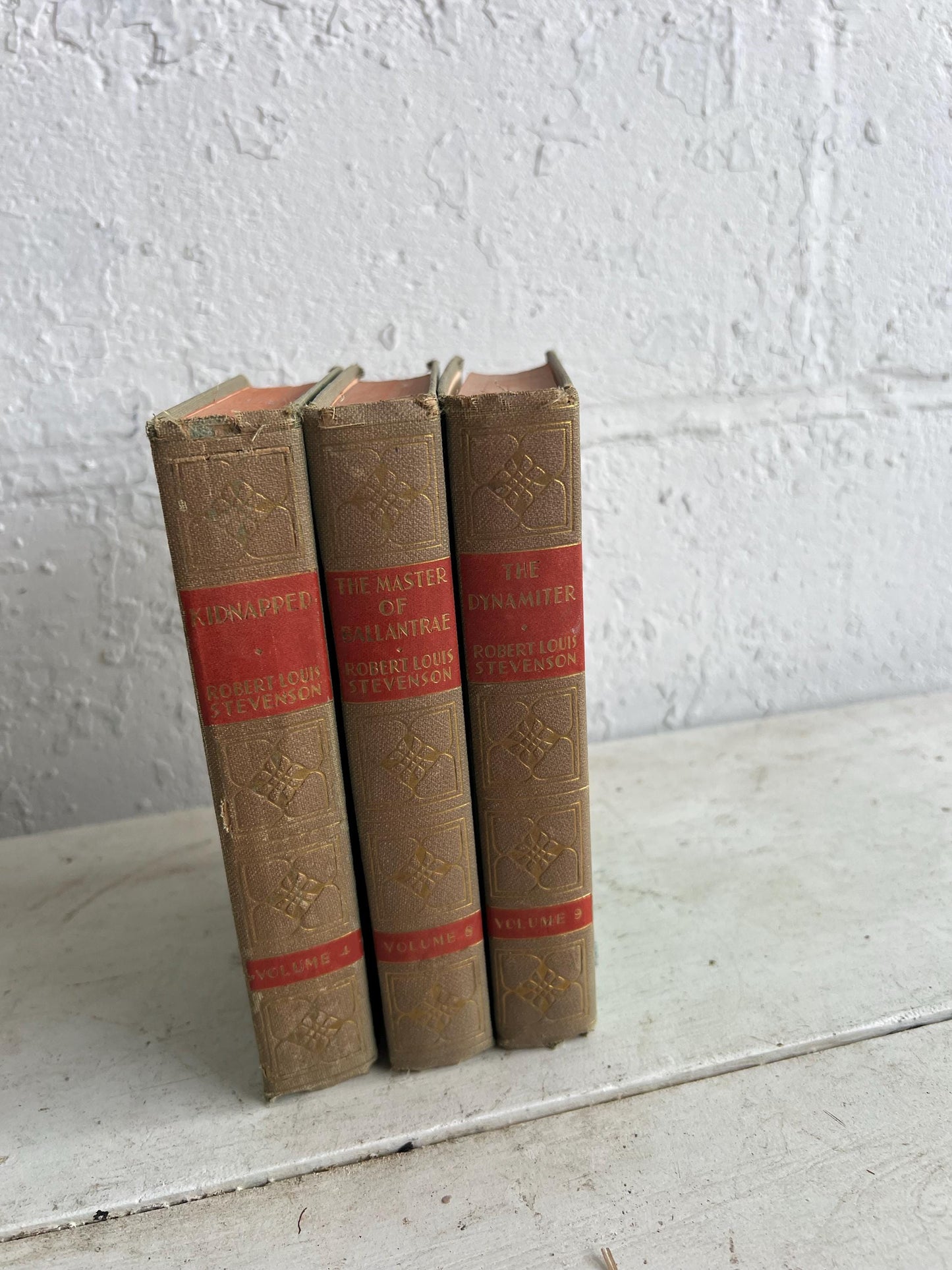VINTAGE BOOK STACK | vintage green with red & gold accents, Robert Louis Stevenson, table styling, old books, coffee table books