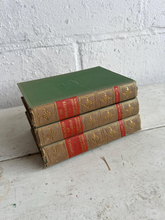 VINTAGE BOOK STACK | vintage green with red & gold accents, Robert Louis Stevenson, table styling, old books, coffee table books
