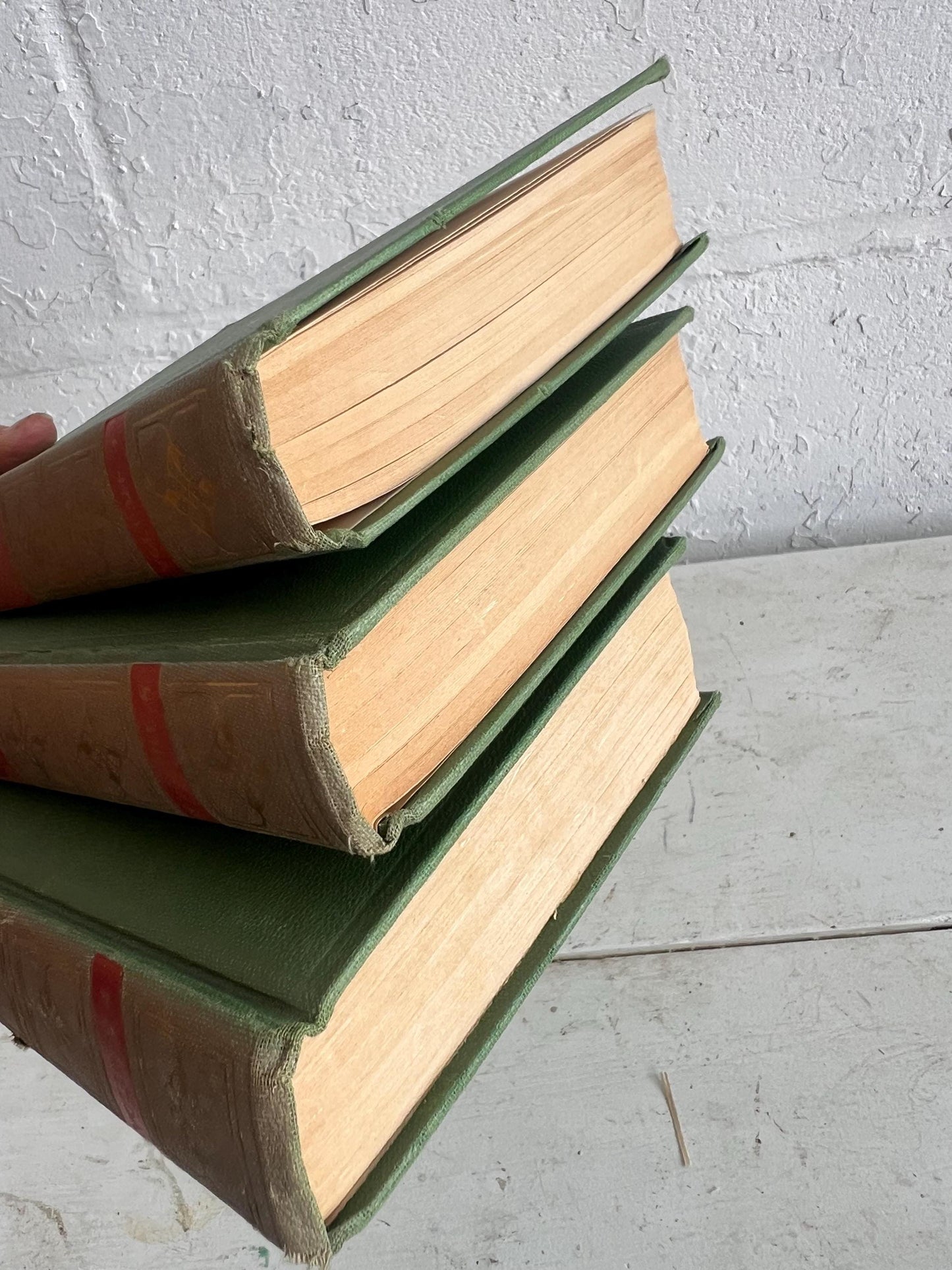VINTAGE BOOK STACK | vintage green with red & gold accents, Robert Louis Stevenson, table styling, old books, coffee table books