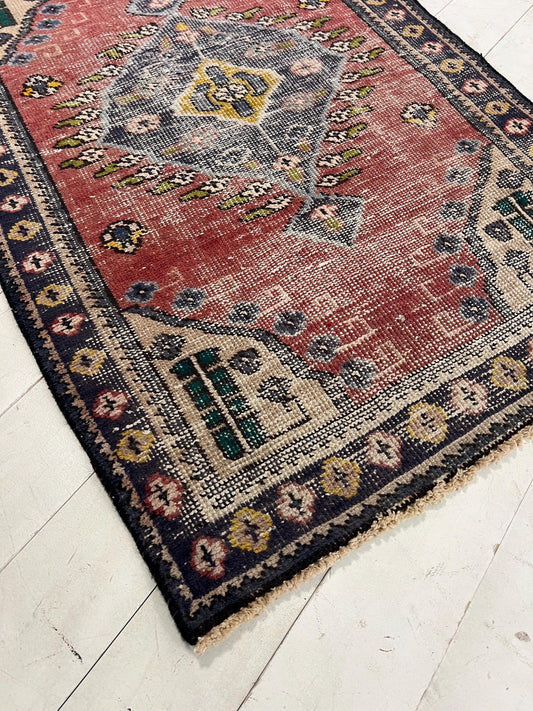 Vintage Oriental Rug: Handmade Mauve Pink Geometric Accent Rug